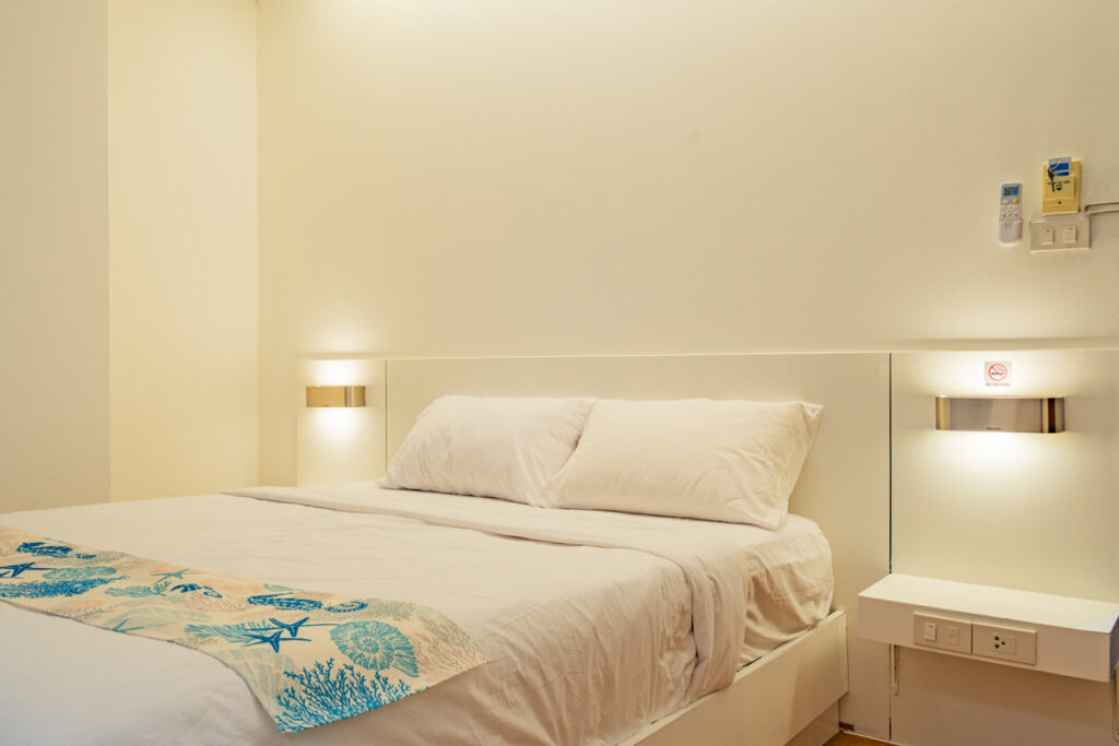 Deluxe Room at Good Breeze Hostel Phuket — spacious room with king bed